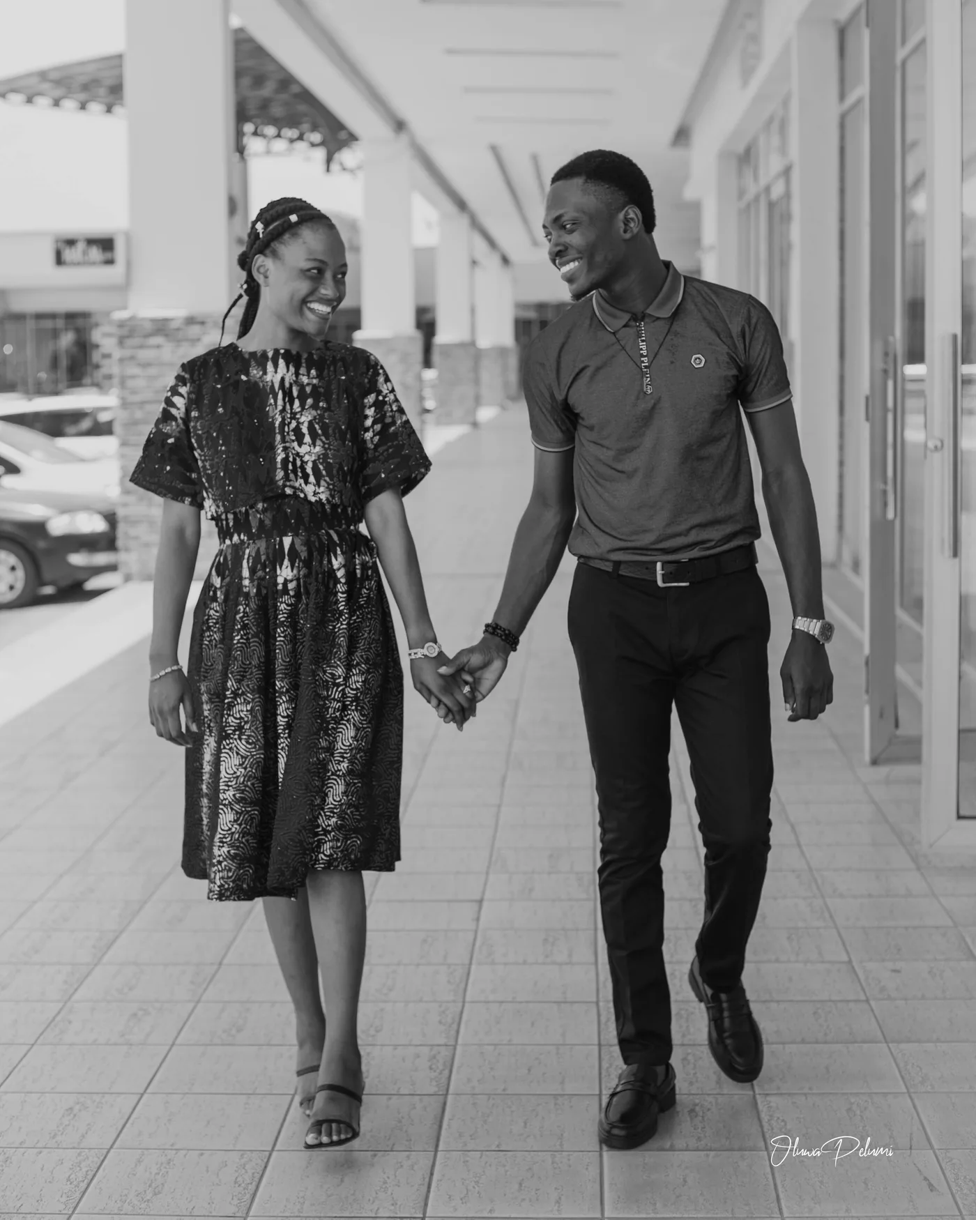 Asepe and Ajibola walking hand in hand