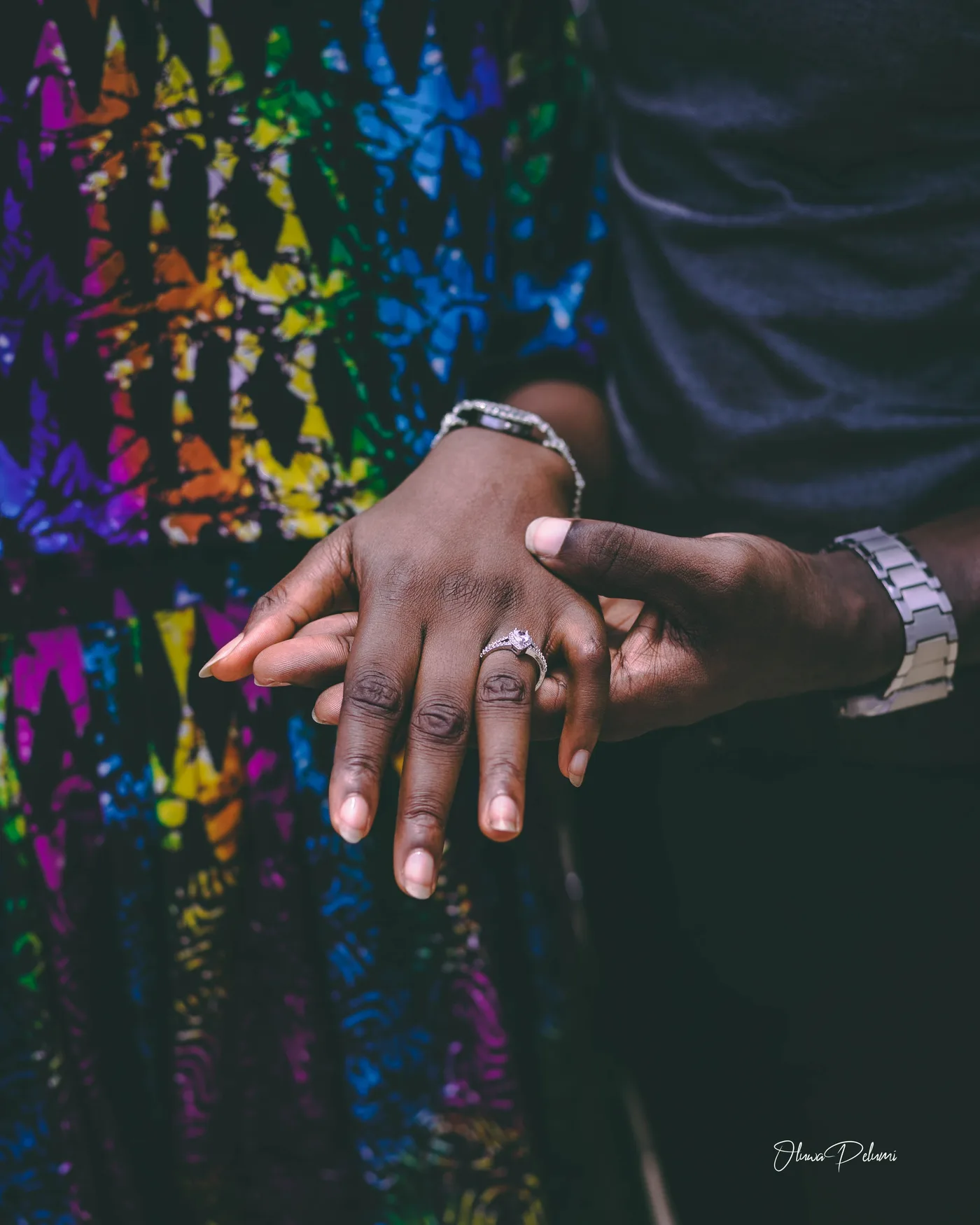Their hands together, showing the ring